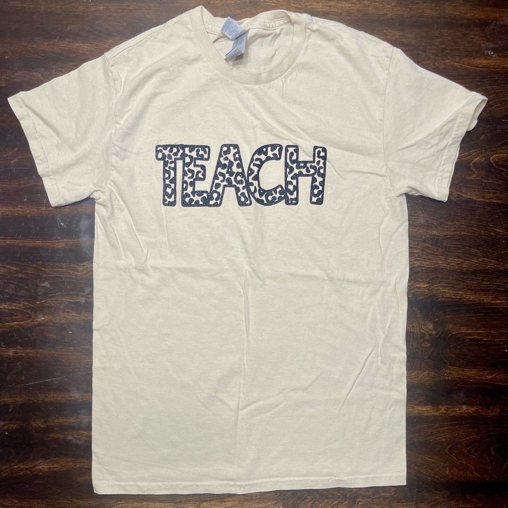 Cream Graphic T-Shirt with 'TEACH' Print